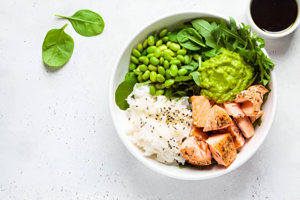  Colorful salmon poke bowl topped with sesame seeds and green onions