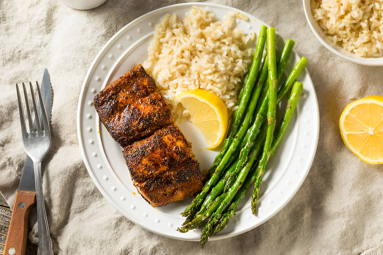 Perfectly blackened mahi mahi fillets sizzling in a skillet with a crispy, flavorful crust.